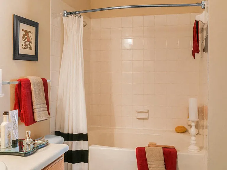 Bathroom with tile surround tub and shower