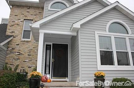 Front Entryway
						:
						Featuring a beautiful brick facade and siding