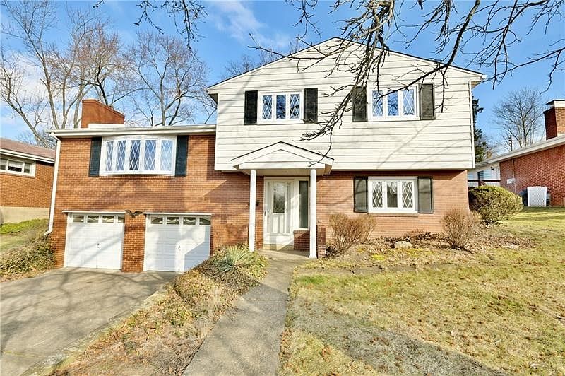 Beautiful inviting split entry, with brick exterior newer windows and doors on a great lot in a fantastic location, close to eve