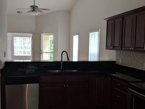 Kitchen looking into living room
