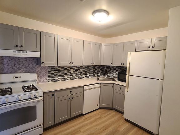 Brand new kitchen cabinets, stone countertop, flooring; with all appliances including dishwasher and microwave