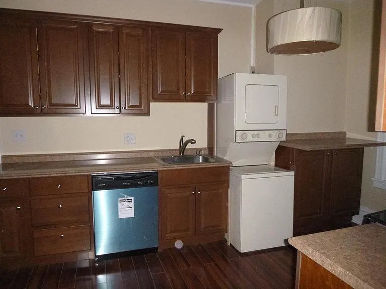 Kitchen with Hardwood floor, stainless appliances and washer