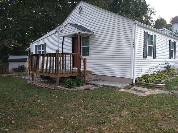 Front door and porch, driveway off right