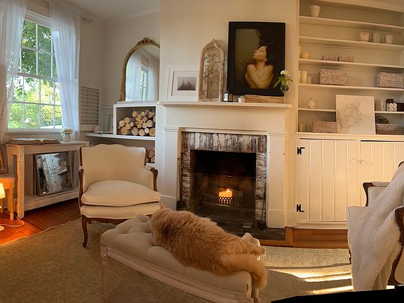 Lovely end unit with lots of light and lovely fireplace and built ins.