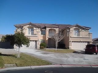 Exterior front with 4 car garage
