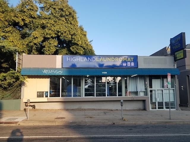 No. Highland Ave frontage, 50' wide. Pedestrian entrance thru gated glass doors , leading to a reception/office/store area. Visibilty and signage!