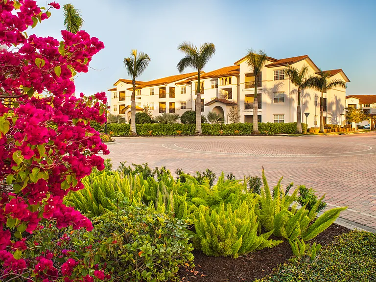 Lush landscaping and modern design create the perfect first impression.
