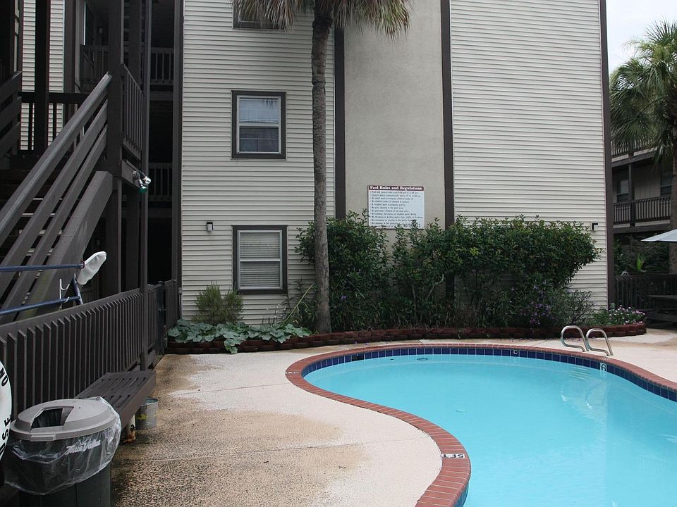 Unit 403 is located on the ground floor facing the pool area.