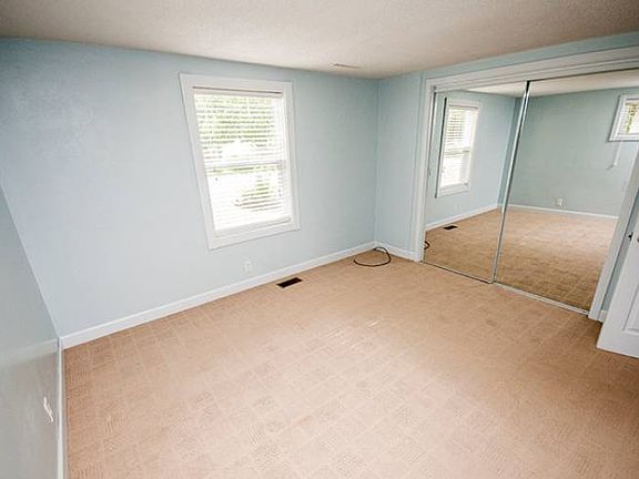 Master bedroom (12x11) with sliding mirror doors.