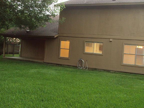 This back yard is oversize and offering extended amount room to hangout with family and friends.