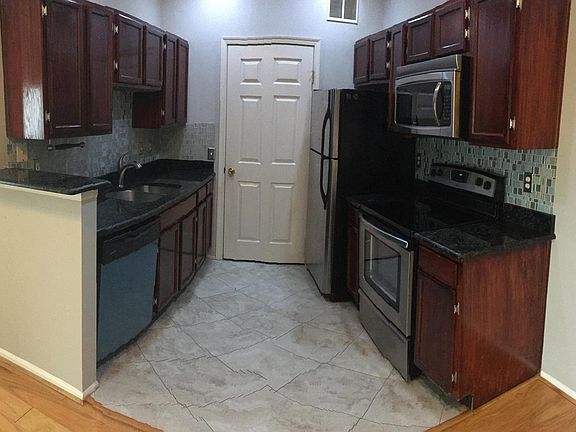panoramic view of kitchen, door leads to laundry room/pantry