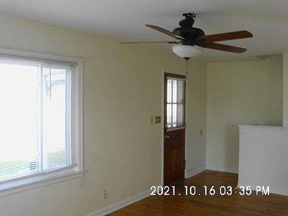 Living room, view of the front door and stairwell