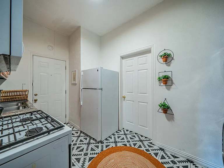 Convenience at your fingertips with a stacked in-unit washer and dryer.