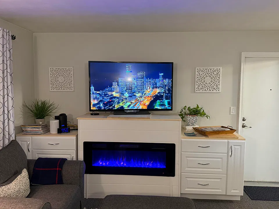 Living room - Built in fireplace and cabinetry stays.