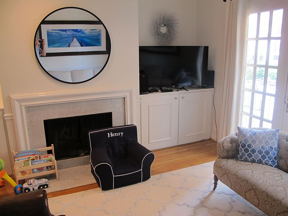 The wood burning fireplace and our TV above one of the two built-in cabinets. A TV can also be placed above the fireplace.