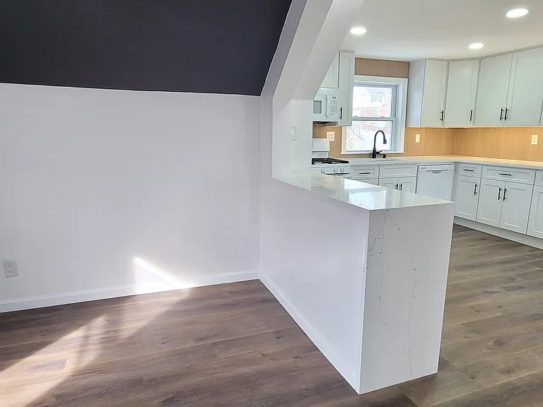 Dining room to kitchen with breakfast counter