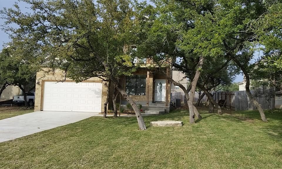 Large trees and lawn at front of house