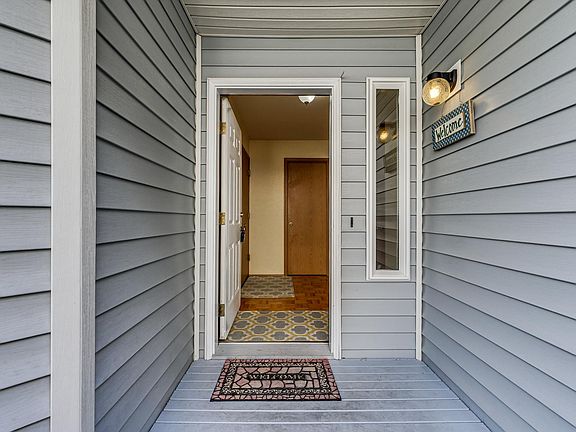 Covered front porch welcomes you into the foyer.