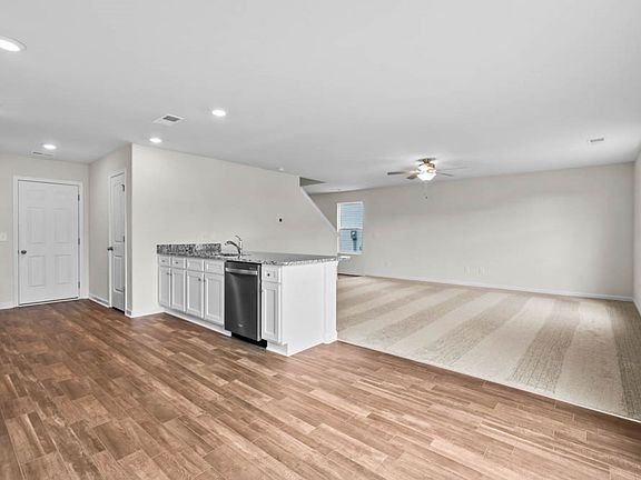 Dining area overlooks the kitchen