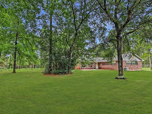 Back yard looking towards main home from shop
