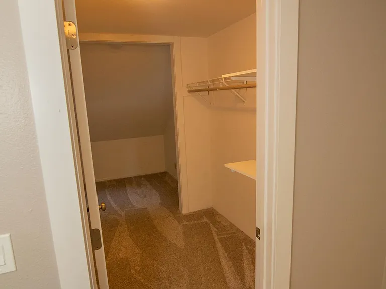 View of PART of the upstairs walk-in closet