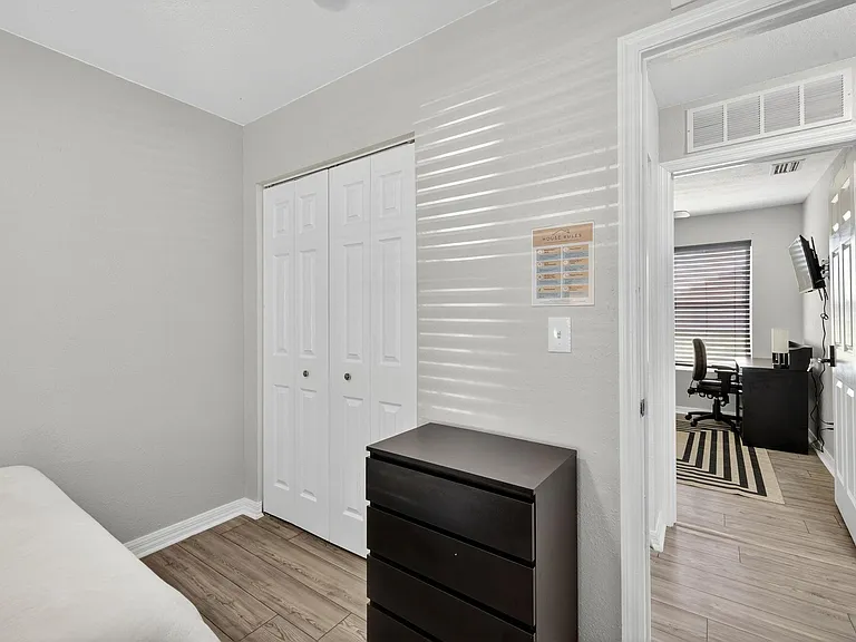 Bedroom 1 featuring the closet & dresser