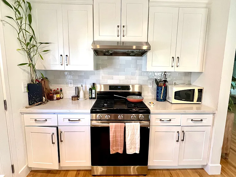 Kitchen: Fully equipped kitchen with quartz countertops and view from the island