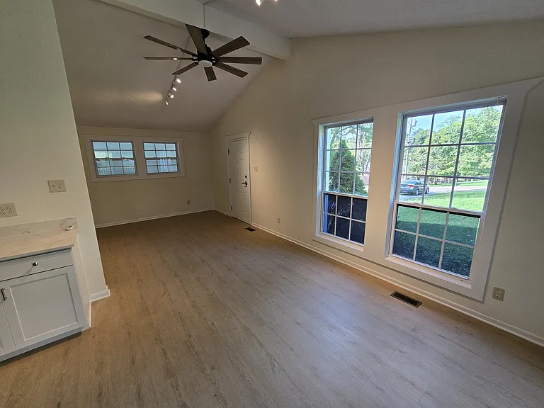 Dining area, living room, and front door.