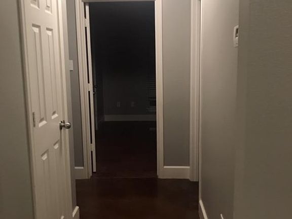 Hallway with extra bedrooms, hall bath and storage closet