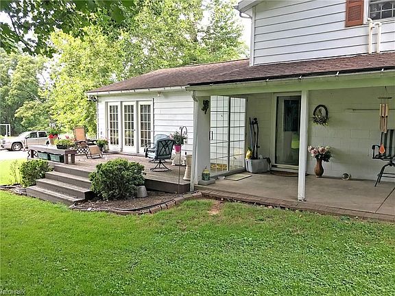 Back of house with patio and deck