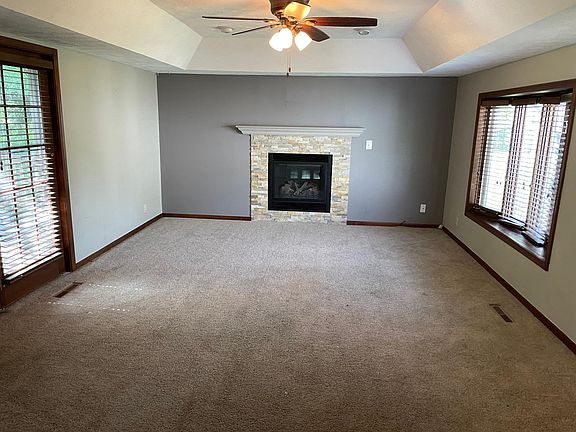 Large family room with gas fire place & walk-out to rear yard deck