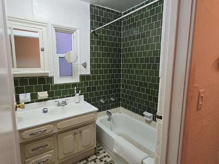 Main bathroom with windows. Clean and ready to use.