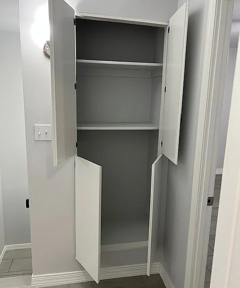 Second Floor Landing, Wall Sconce Lighting, Brand New Tile and Grout Flooring, New Baseboard Molding, Linen Closet, Stairwell, Freshly Painted Ceiling, Walls, New Baseboards and New Moldings.