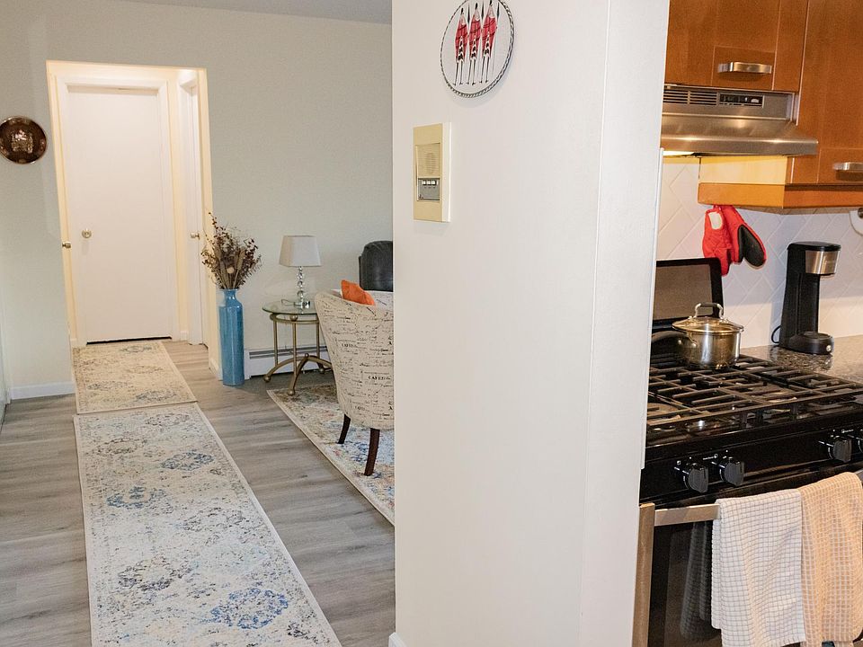 Hallway leads to living room. Right: Kitchen