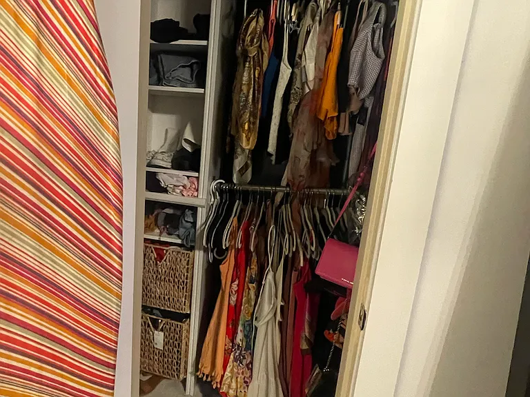 Reach-in closet off of primary bedroom