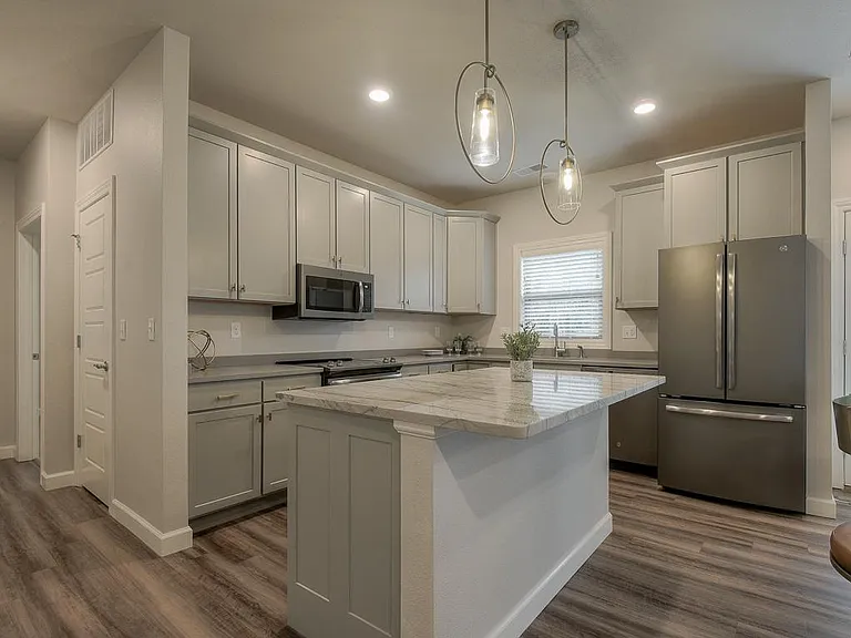 The Cardiff- Spacious Kitchen w/Large Center Island That Opens to Dining Area and Great Room/Living Area