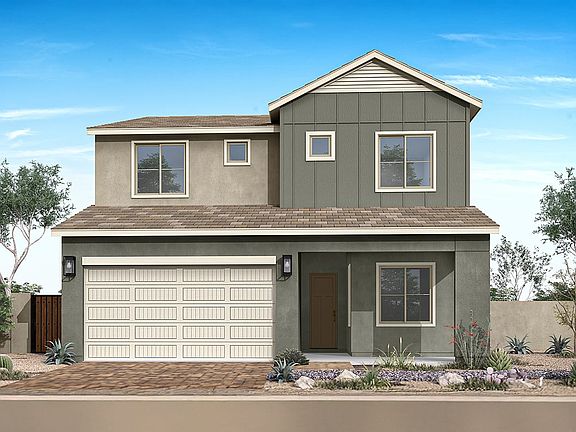 A two-story residential house with a garage, surrounded by landscaping and a fence, set against a cl