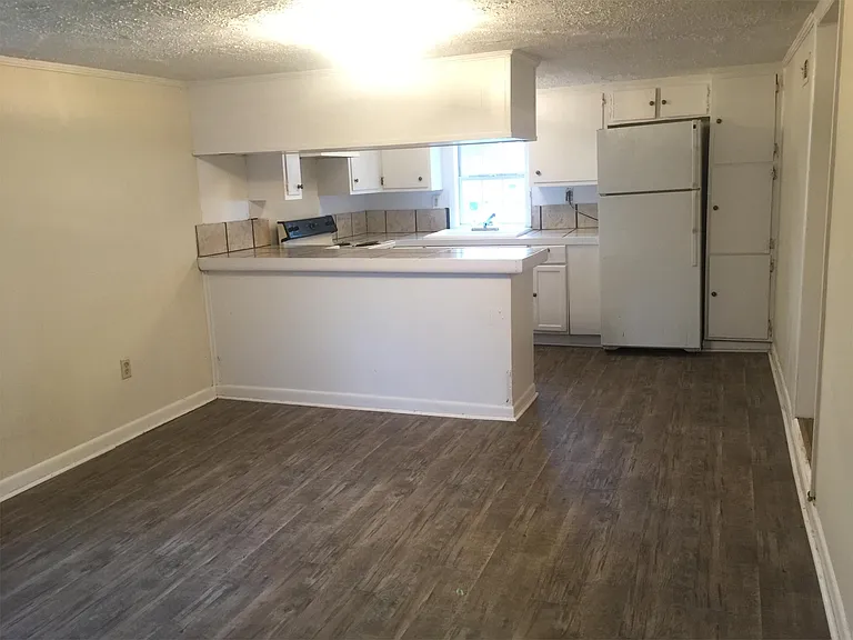 View of dining room and kitchen from carport area