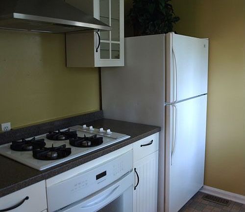 view of kitchen -- fully remodeled with convection oven, stainless range hood