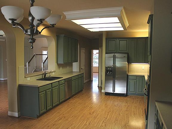 Plenty of cabinets and counter tops in this spacious kitchen.