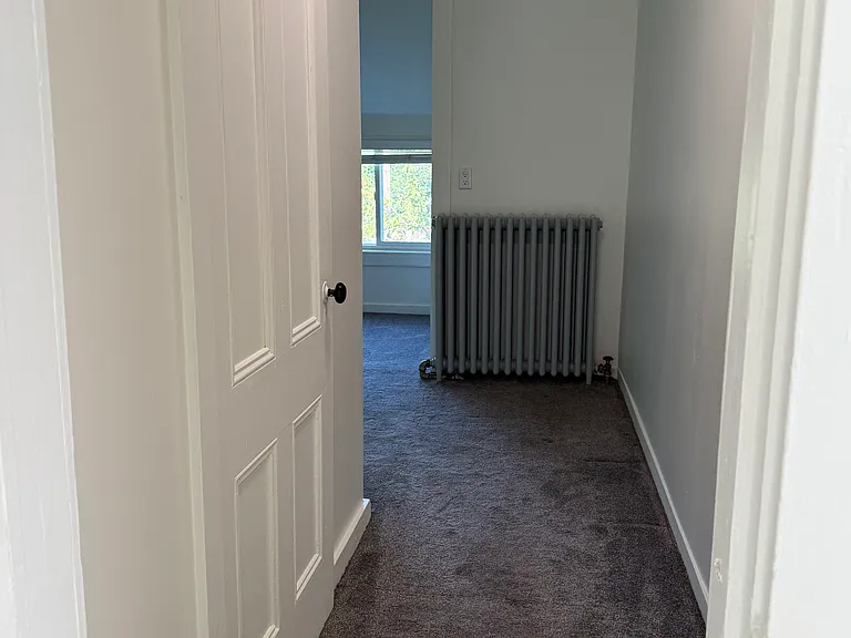 hall from bathroom, front door and closet looking toward LR