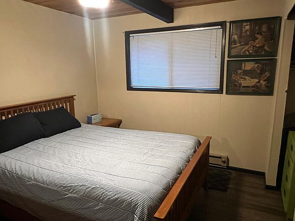 Main floor bedroom with a queen size bed.
