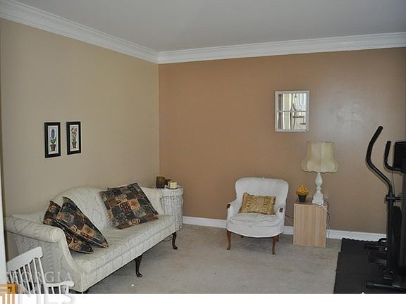 TO THE RIGHT THE FORMAL LIVING ROOM