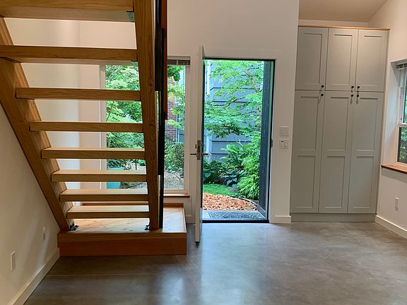 Looking toward front door. Closet/Storage cabinets in living room.