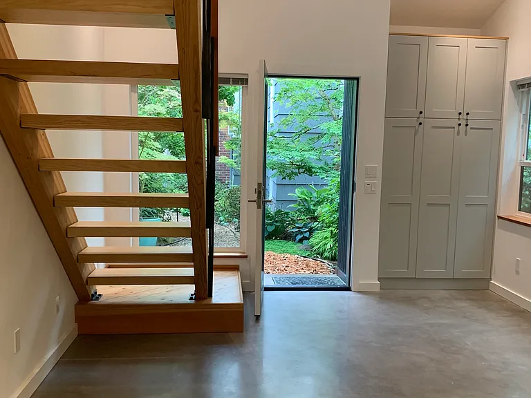 Looking toward front door. Closet/Storage cabinets in living room.