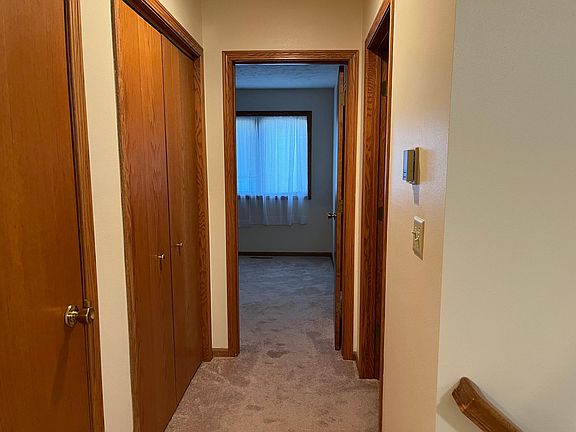 Front hall with coat and linen closet