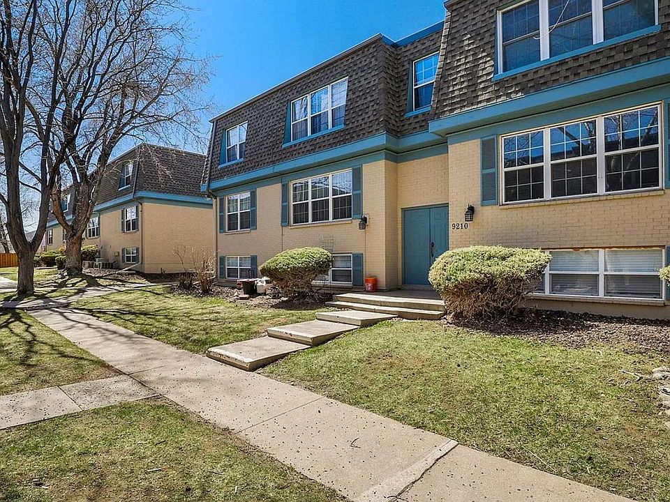 Charming condo complex with a landscaped courtyard, providing peaceful views right outside your window.