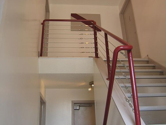 Unit #1 is located at the top of the stairs to the right. It is one of just 4 apartments in the building.