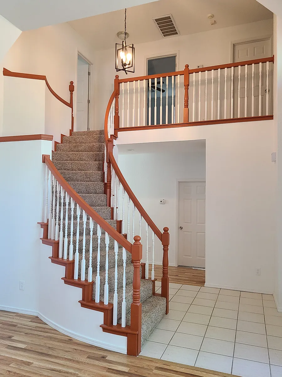 Foyer and spiral staircase - 9215 S Erie Ave