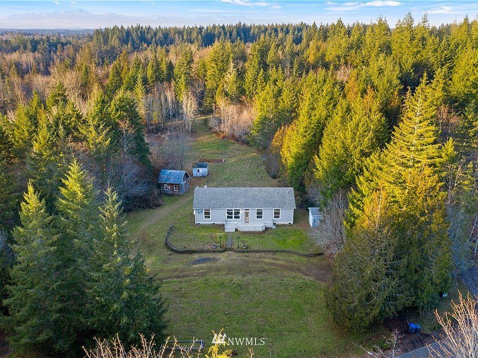 Aerial view of the property from the front. >